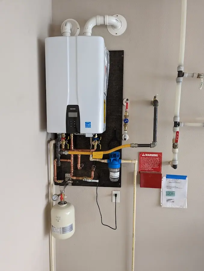 Professional plumber installing copper piping in a High Springs home